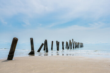 Stunning views of the concrete columns of the old port that crumbled in the sea of Thailand.