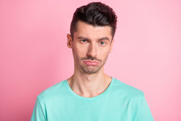 Obraz premium Portrait of young unhappy upset exhausted stressed bad mood man look camera isolated on pink color background