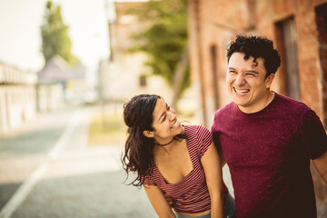 Obraz premium Young happy couple spending time on the street.