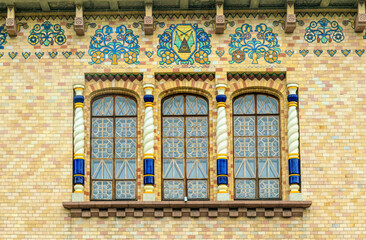 Poltava, Ukraine - April 14, 2021: Beautiful historical building in the Ukrainian Art Nouveau style. Museum of Local Lore in Poltava, Ukraine. Facade painted wall