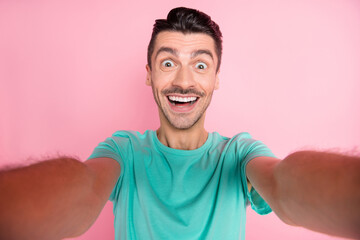 Photo of young handsome man happy positive smile make selfie record video isolated over pastel color background