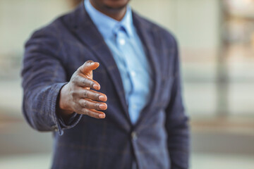 African American businessman extending hand to shake. Partnership concept. Businessman with an open hand ready for handshake. concept about agreement, partnership and win-win situation