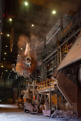 Fototapeta na wymiar Ust'-Kamenogorsk, Kazakhstan - May 31 2012: Copper metallurgy factory workshop. Melting of copper with Pierce-Smith converter. Metallurgical bucket with liquid metal.