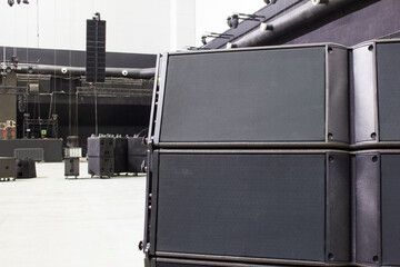 Line array sound speakers. Stage, trusses, led screen, stage lighting. Installation of concert equipment.