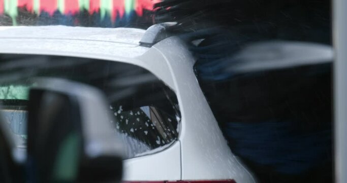 automatic car wash. large machine parts at the car wash. UHD video