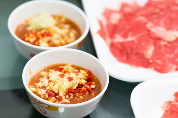 spicy dipping with raw slice meat in Thai style