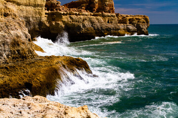Rocky Algarve coast with waves