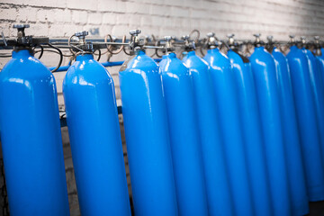 Oxygen cylinder with compressed gas. Blue Oxygen tanks for industry. Liquefied oxygen production. Factory - obrazy, fototapety, plakaty