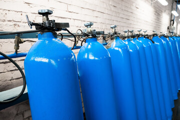 Oxygen cylinder with compressed gas. Blue Oxygen tanks for industry. Liquefied oxygen production....
