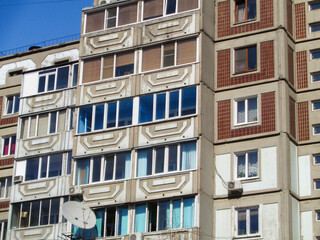 Fototapeta premium Soviet apartment buildings. Apartment block. Soviet architecture. Ust-Kamenogorsk (Kazakhstan). Concrete apartment buildings. Bright. Closeup detailed fragment. Plattenbau