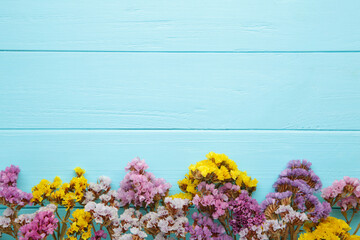 Flowers composition. Gypsophila flowers on blue wooden background. Spring, summer concept. Flat lay, top view.