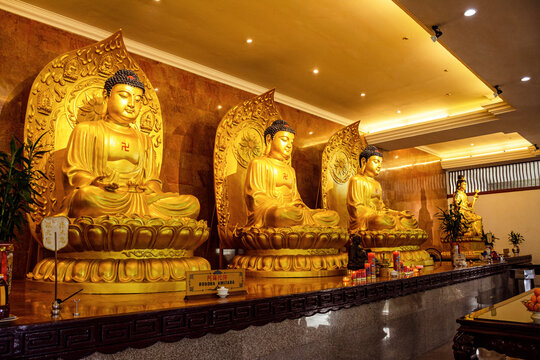 Visit the biggest temple in Batam island, Indonesia - Nov 29, 2018, The golden buddhist statues in the church. The Maha Vihara Duta Maitreya Temple in Batam Island.