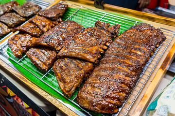BBQ pork ribs grilled over charcoal.Delicious in Thai night market.Unhealthy but tastiest food