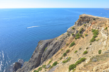 Cape Fiolent. Beautiful views of the Black Sea coast at Cape Fiolent in summer in clear weather. Aerial view to beautiful sea coast with turquoise water and rocks