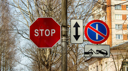 prohibiting and warning road signs on the post by the road