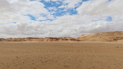 Fototapeta na wymiar The beautiful sands and rocks formations due to erosion in Fayoum desert in Egypt