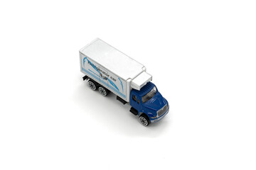 Model of toy truck on white background.