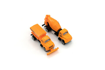 Buldozer and cement mixer isolated on white.