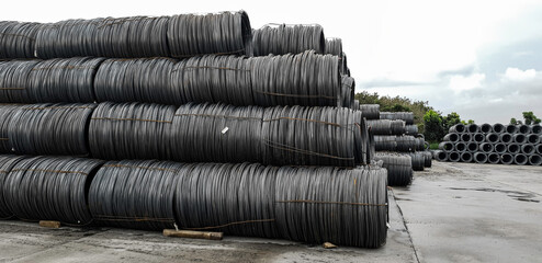 Stacked of high carbon wire rod for heavy industry production,Pile of metal steel wire roll for construction site, concrete usage and building construction