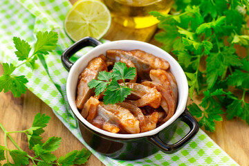 Pickled herring in tomato sauce with sweet onions