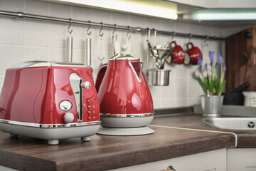 Red toaster and electric kettle in retro slile
