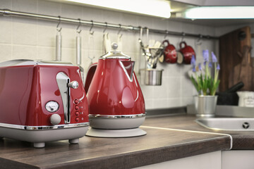 Red toaster and electric kettle in retro slile