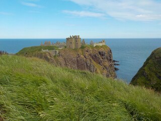 Fototapeta na wymiar The most spectacular castles in Scotland. The castle on the edge of the abyss - Dunnottar castle.