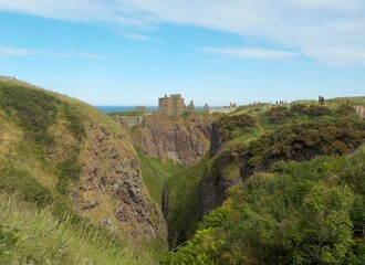 Obraz premium The most spectacular castles in Scotland. The castle on the edge of the abyss - Dunnottar castle.