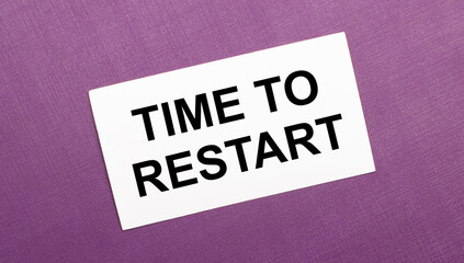 On a lilac background, a white card with the words TIME TO RESTART
