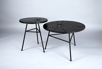 Round tables which were shot in studio with flash light on a grey background