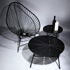 Chair with concrete block shot in studio with flashlight on a grey background