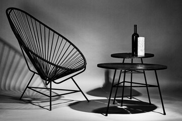 Chair with concrete block shot in studio with flashlight on a grey background