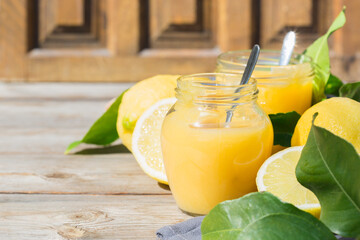 Homemade lemon curd, custard cream with yellow fruits