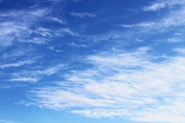 Naklejka na ściany i meble Beautiful blue sky and white cirrocumulus clouds. Background. Texture. Scenery.