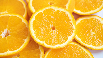 Sliced orange background. Sliced tangerine background. Juicy slice of orange. Healthy orange slices.