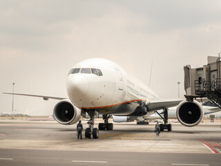 Fototapeta na wymiar Airplane near the terminal in an airport