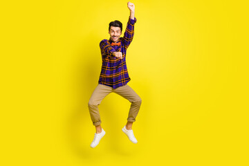 Full body photo of young excited man happy positive smile cowboy ride horse rodeo isolated over yellow color background - obrazy, fototapety, plakaty
