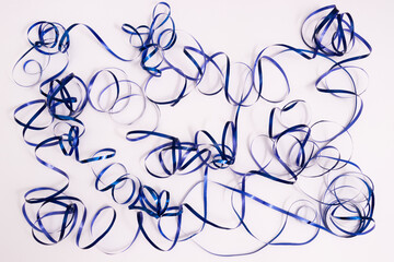 Shiny curly blue ribbon. Serpentine background. On a white.