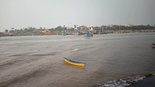 Boat floating on river of daman located in India, daman-ganga river