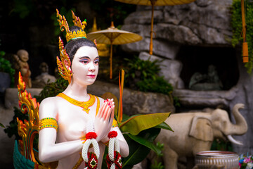BANGKOK, THAILAND - April 14, 2021: Kinnaree statue or female bird with a human head in Wat Saket Golden Mountain Temple famous, is a Buddhist temple in Pom Prap Sattru Phai district, Bangkok.