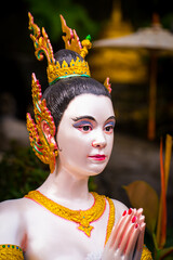 BANGKOK, THAILAND - April 14, 2021: Kinnaree statue or female bird with a human head in Wat Saket Golden Mountain Temple famous, is a Buddhist temple in Pom Prap Sattru Phai district, Bangkok.