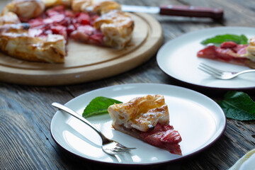 tart with strawberries on a wooden table. Copy space, top view.