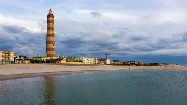 Lighthouse from the beach of Barra in Aveiro district in Portugal 