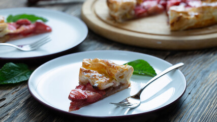 tart with strawberries on a wooden table. Copy space, top view.