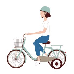 補助輪付き自転車に乗っている女の子
