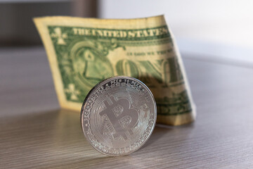 bitcoin coin on a dollar background