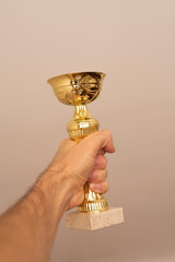 winner cup in hand close-up