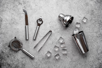 Set of cocktail drink tools and ingredients with shaker and ice. Flat lay