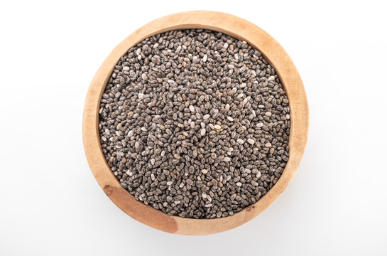 Chia seeds. Chia seeds in wooden bowl on white background. chia © camberson