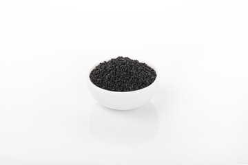 Black cumin seeds. Black cumin in white bowl on white background. nigella sativa, black sesame, black cumin,